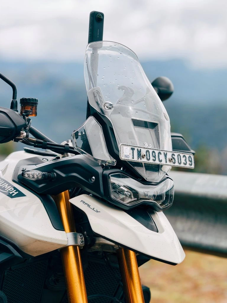 Triumph Tiger 900 Rally Pro on a damp forest road after testing